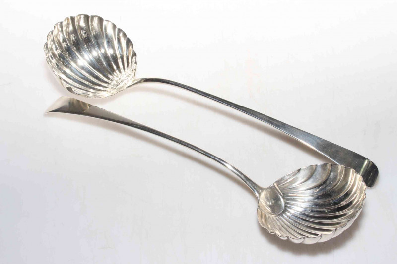 Matched pair of George III silver Old English pattern soup ladles with shell bowls, London 1774 and 1779, 32cm by 33cm lengths.