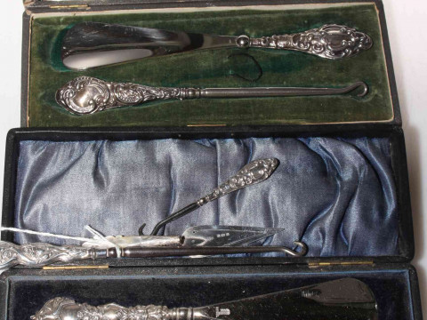 Cased and loose silver handled button hooks and shoe horns, bookmark and...