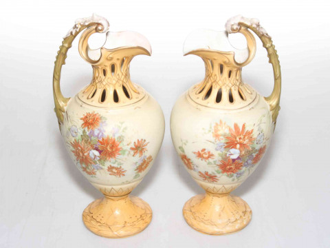 Pair Royal Vienna blush ewers with flower decoration, 24cm.