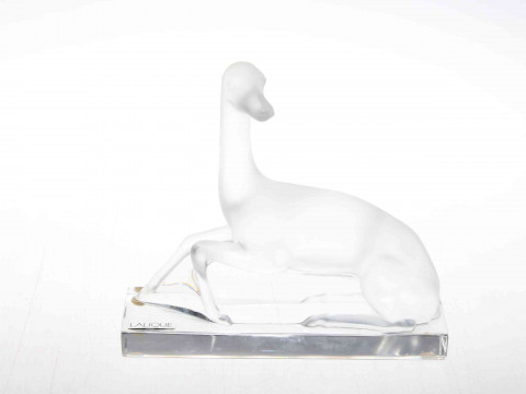 Lalique greyhound, etched mark to base, 21cm wide, 19.5cm high.
