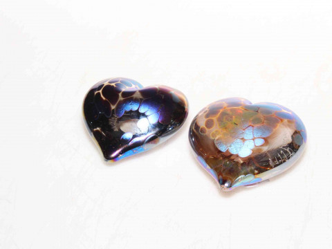 Two John Ditchfield heart shaped paperweights.