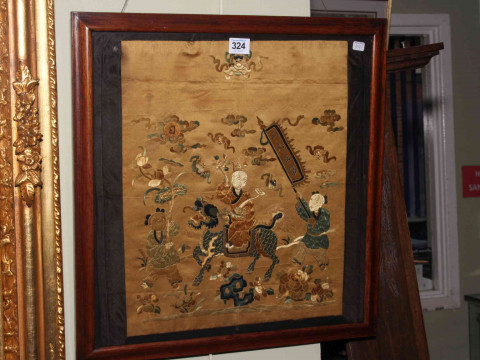 Framed Chinese silkwork depicting a Gentleman Riding a Dragon with Two...