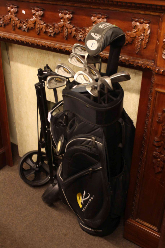 Golf bag, caddy and set of twelve golf clubs including Callaway Big Bertha.