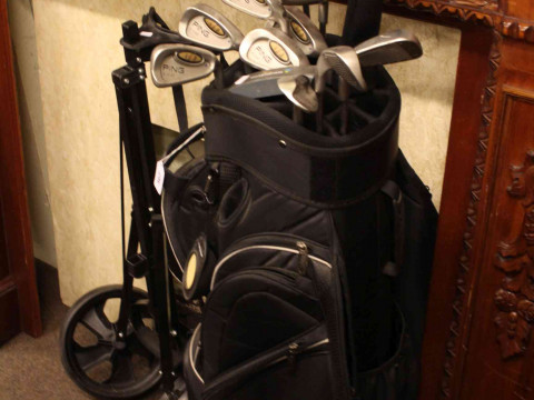 Golf bag, caddy and set of twelve golf clubs including Callaway Big Bertha.
