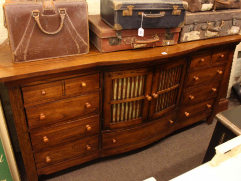 Oak bow front centre sideboard, 90cm by 183cm by 51cm.