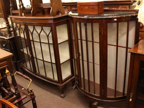 Two early 20th Century mahogany china cabinets.
