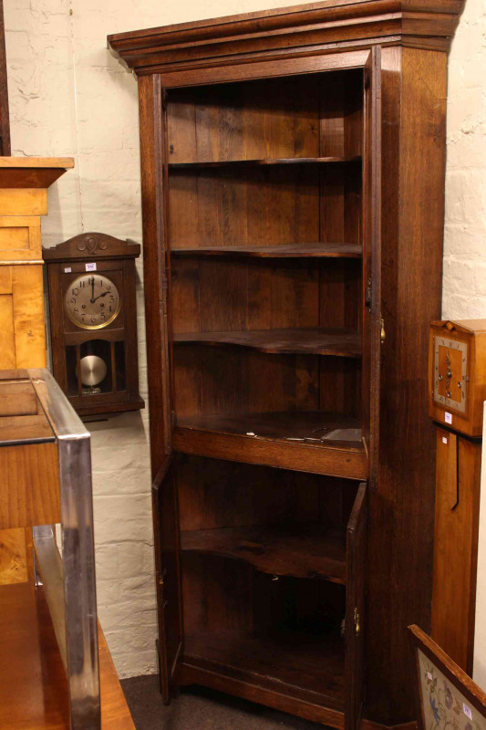 19th Century oak four door standing corner cabinet, 214cm.