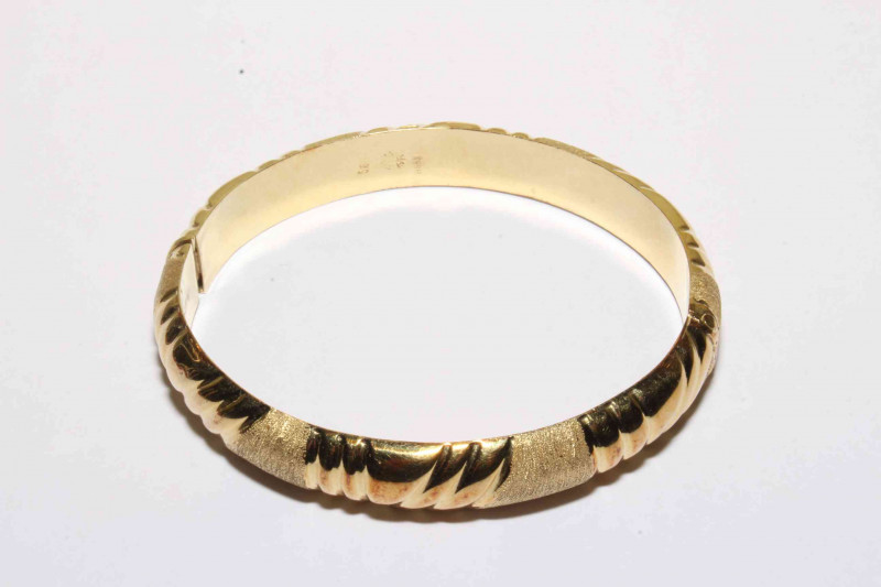 14 carat two tone yellow gold bangle.