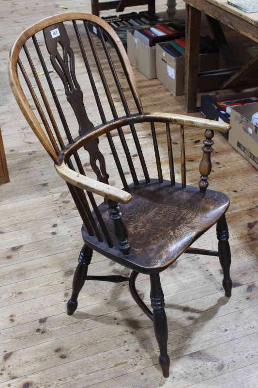 Antique Windsor pierced splat back elbow chair with crinoline stretcher.