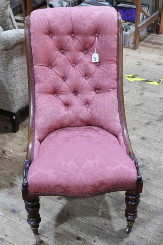 Victorian mahogany framed nursing chair on turned legs.