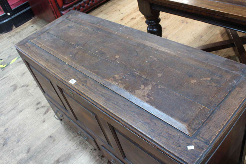 Antique oak triple front coffer with two base drawers, 74cm x 130cm x 49cm.
