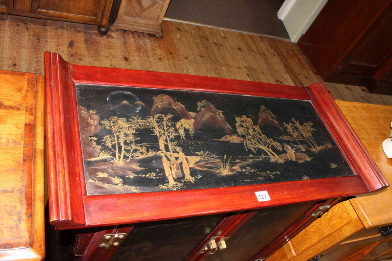 Oriental lacquered cabinet having two lacquered panel doors above two drawers, 93cm by 81.5cm by 38cm.