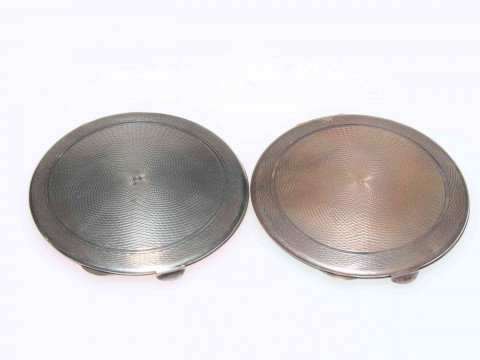 Two Art Deco silver and green and pink guilloché enamel compacts, both Birmingham 1939, 7cm diameter. thumbnail