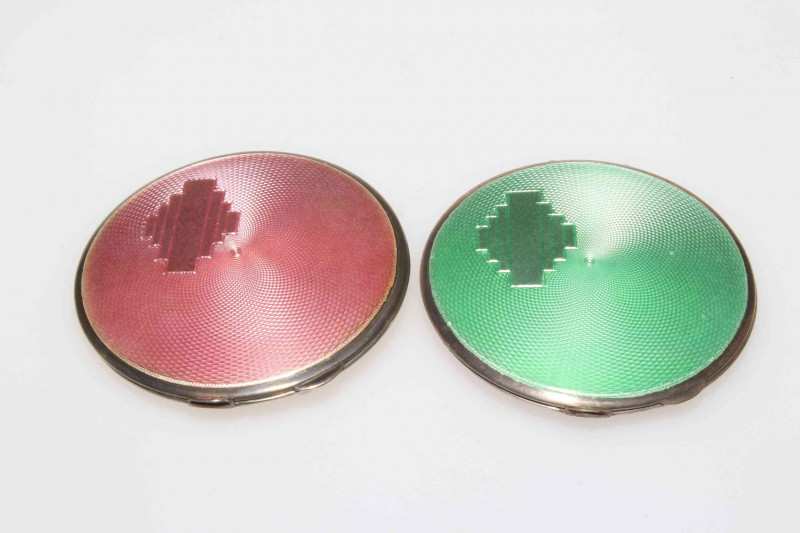 Two Art Deco silver and green and pink guilloché enamel compacts, both Birmingham 1939, 7cm diameter.