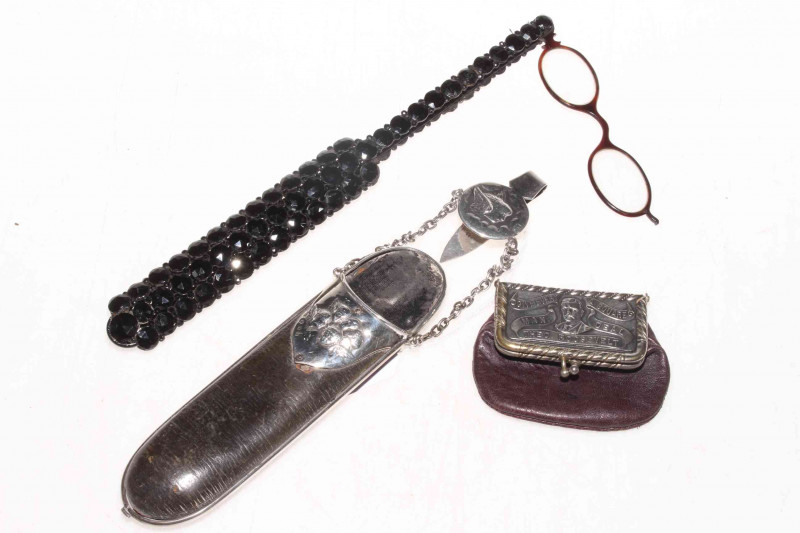 Late Victorian silver mounted leather spectacle case, Birmingham 1897, American Roosevelt purse, and blank beaded lorgnette (3).