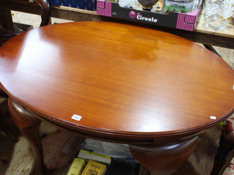 Late 19th/early 20th Century oval mahogany dining table on ball and claw legs, 74cm by 120cm by 89cm, together with four later Victorian style mahogany balloon back dining chairs. thumbnail
