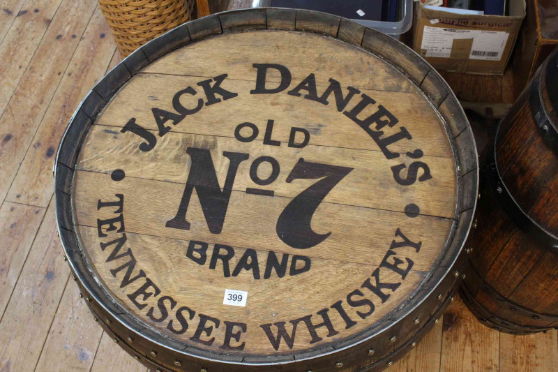 'Jack Daniels' barrel topped low table, 47cm by 63cm diameter.