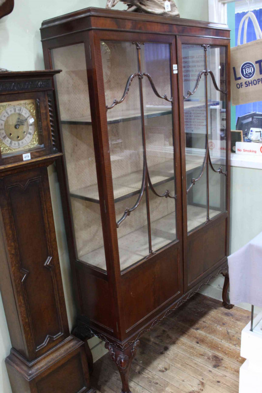 Early 20th Century mahogany Chippendale style two door vitrine on ball and claw legs, 183cm by 105cm by 33cm.