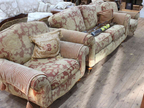 Four piece lounge suite comprising large two seater settee and three armchairs in floral pattern fabric. thumbnail
