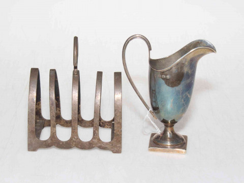 Silver helmet cream jug, Birmingham 1907, and silver five bar toast rack,...