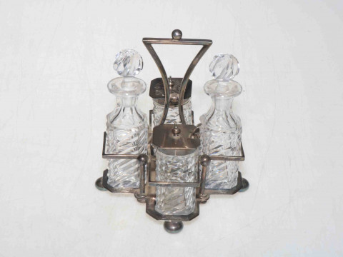 Late Victorian silver four bottle cruet, Sheffield 1891, having two silver...