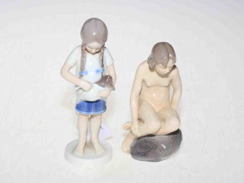 Two Royal Copenhagen figures, naked girl on rock 4027, and girl with kitten...