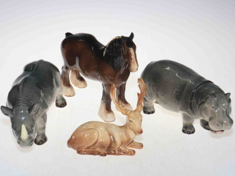 Melba Pottery hippo and rhino, together with Beswick shire and stag (4).