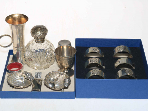 Silver items comprising set of six napkin rings, two spirit measure, egg...