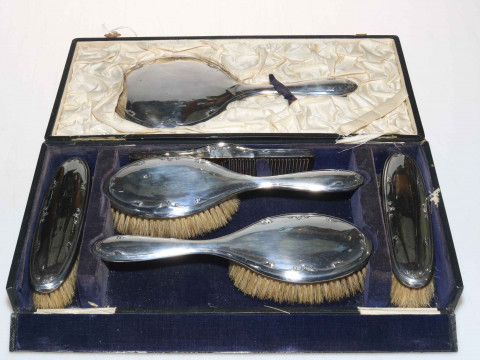 Silver backed six piece brush set, cased.