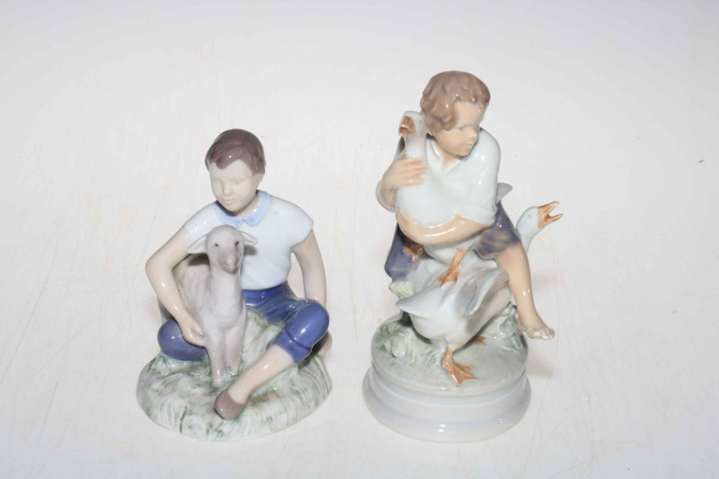Two Royal Copenhagen and Bing & Grondahl figures, Goose Thief 2139 and Girl with Happy Lamb 2336, tallest 17cm.