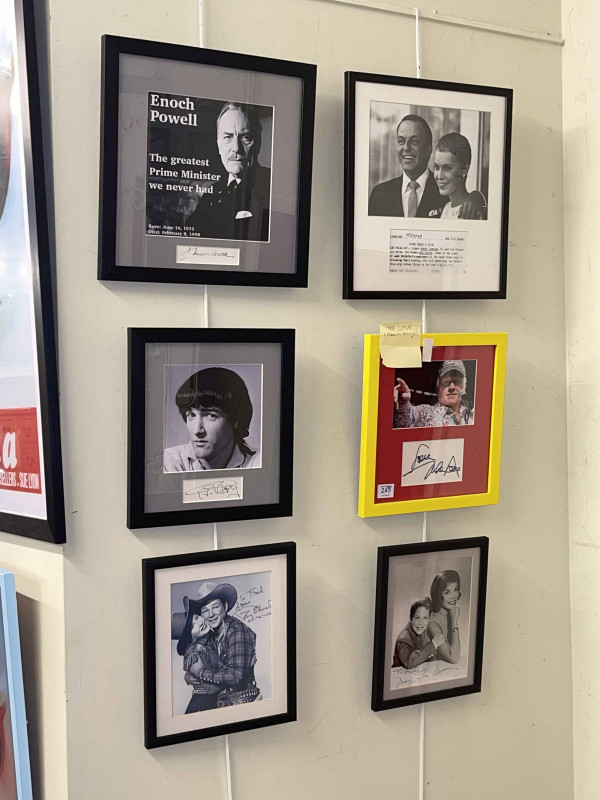 Large collection of framed cinema/theatre/political interest inc signed clippings (Enoch Powell, P. J. Proby), Ronald Reagan quote, Lolita, etc.