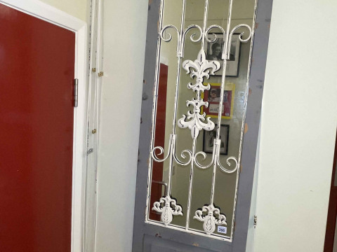 Wood and metal framed decorative mirror, 150cm by 42cm.