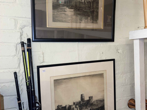 Two framed etchings of Newcastle and Durham.