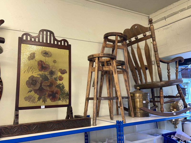 Farmhouse style rocking chair, three circular bar stool frames, mahogany and painted glass firescreen, oak kerb and brass coal bucket.