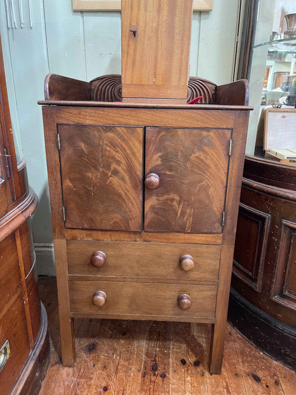 Mahogany 3/4 gallery backed commode having two doors above two drawers, 91.5cm by 52cm by 50cm.