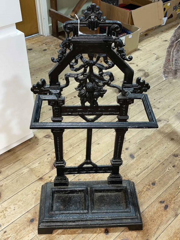 Cast iron arched top stick stand, 85cm by 43cm by 21cm.