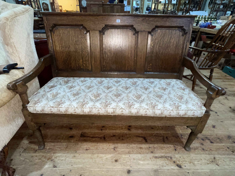 Georgian oak triple arched fielded panel back settle, 103.5cm by 138cm by 70cm.