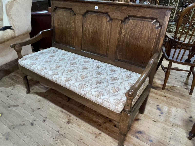 Georgian oak triple arched fielded panel back settle, 103.5cm by 138cm by 70cm.