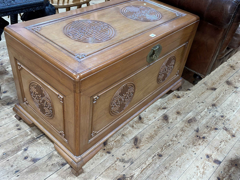 Oriental carved camphorwood trunk, 60cm by 103cm by 53cm.