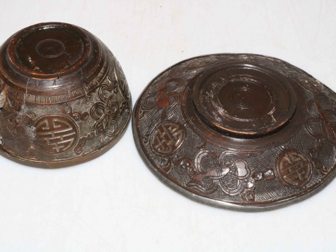Chinese 19th Century hardwood cup and saucer decorated with Buddhist objects. thumbnail