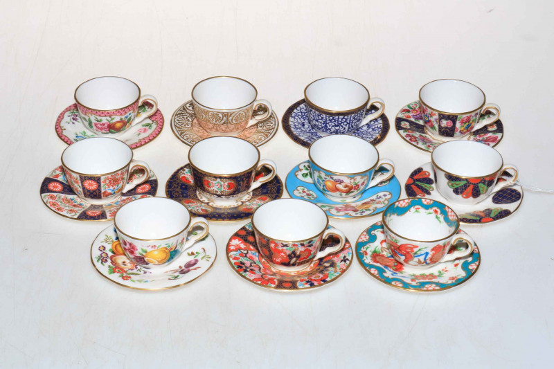 Collection of eleven Royal Worcester miniature cabinet cups and saucers.