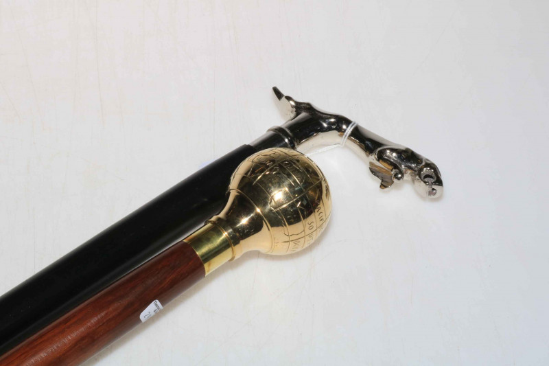 Jaguar handled walking stick and globe mounted walking stick.