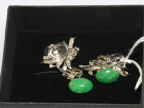 Pair ornate jade earrings.