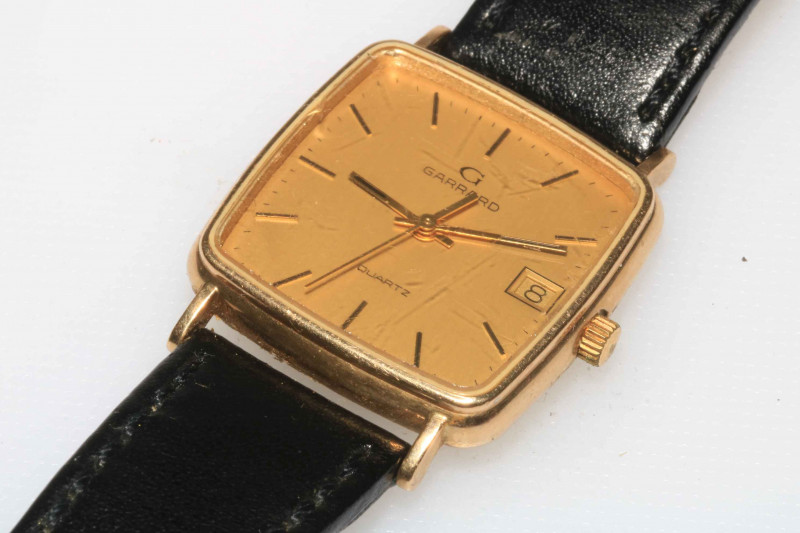 Gents 9 carat gold Garrard watch with box and papers.