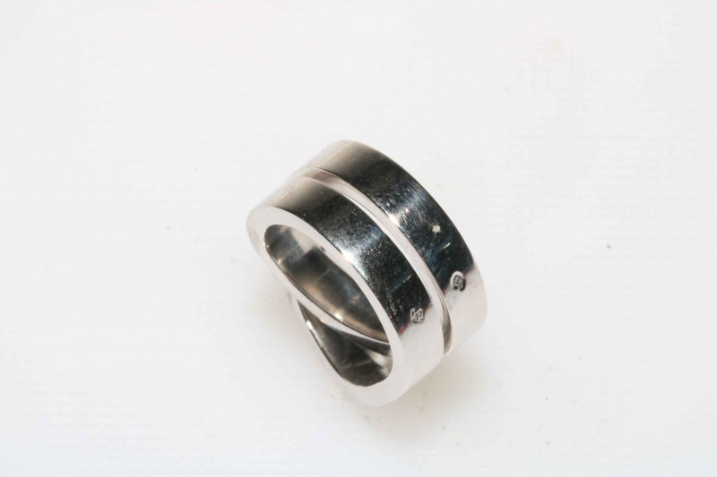 Cartier 18 carat white gold ring of entwined/knot form, marked c1999 Cartier J00459, size G, in original case and outer box.