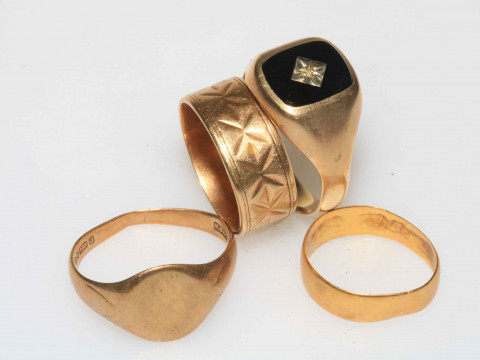 Three 9 carat gold rings and one 22 carat gold ring (4).