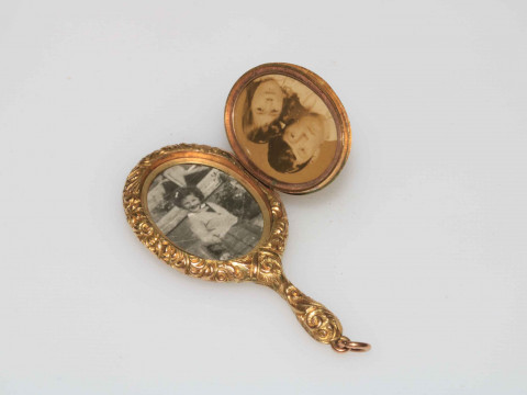 WITHDRAWN                   Gold miniature locket in the form of a hand mirror, bearing registration number 451092. thumbnail
