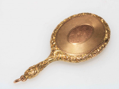 WITHDRAWN                   Gold miniature locket in the form of a hand...