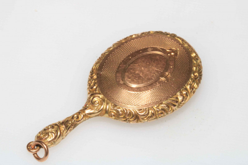 WITHDRAWN                   Gold miniature locket in the form of a hand mirror, bearing registration number 451092.