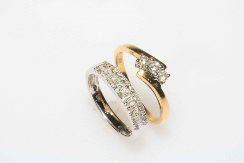 Two 18 carat gold and diamond dress rings.